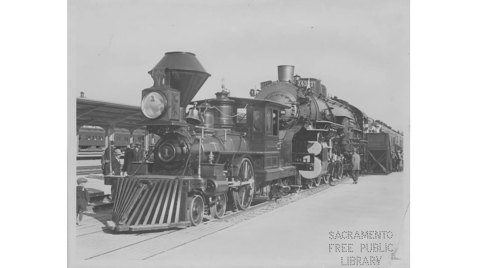 a black and white photo of a steam locomotive