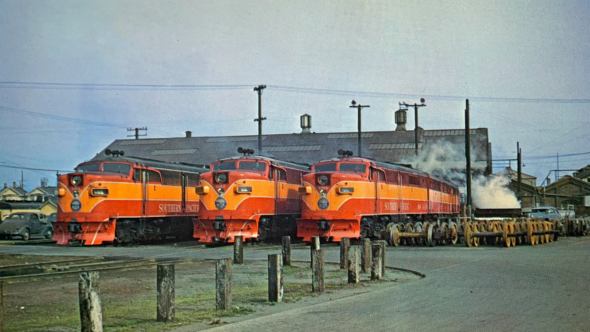a photo of three red and orange Southern Pacific locomotives