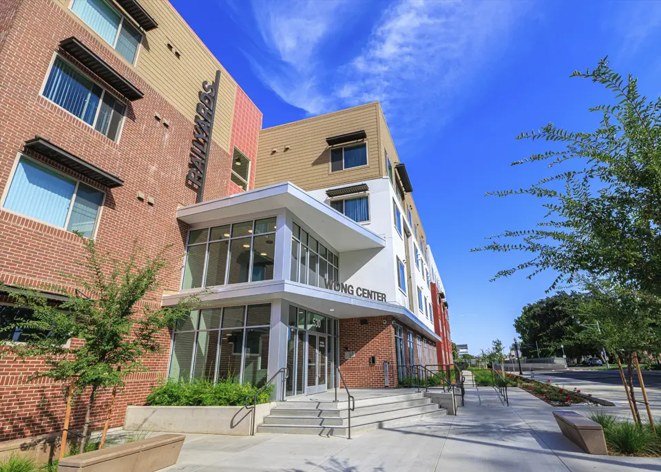 a photo of the front entrance of the Wong Center with stairs leading up to a doorway